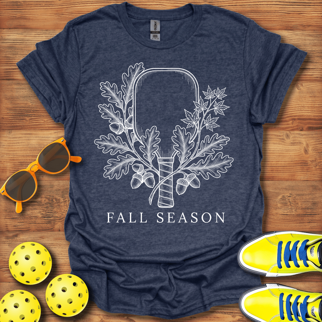 A heather navy blue t-shirt with a white graphic of an autumn harvest bow and acorns, with the text 'FALL SEASON' printed below. 